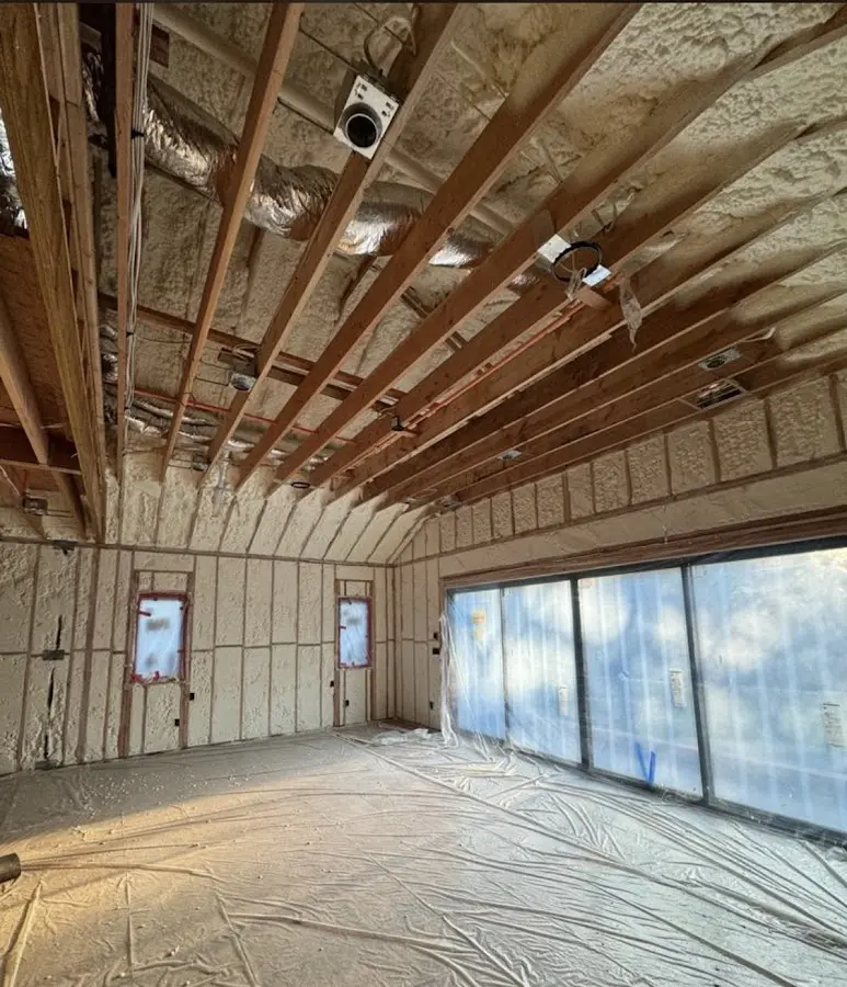 Interior walls and ceiling insulated with spray foam during new construction in Cottage Lake